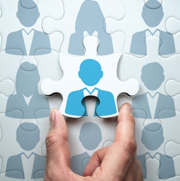 Puzzle piece with person icon being placed.